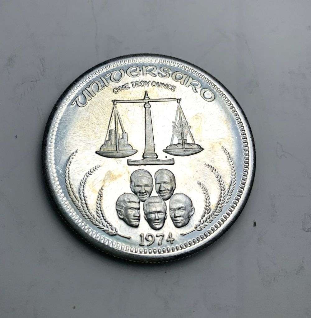 1974 Universaro World Trade 1 ozt .999 Silver: Winner shall receive the exact coin shown here. (MK/B)