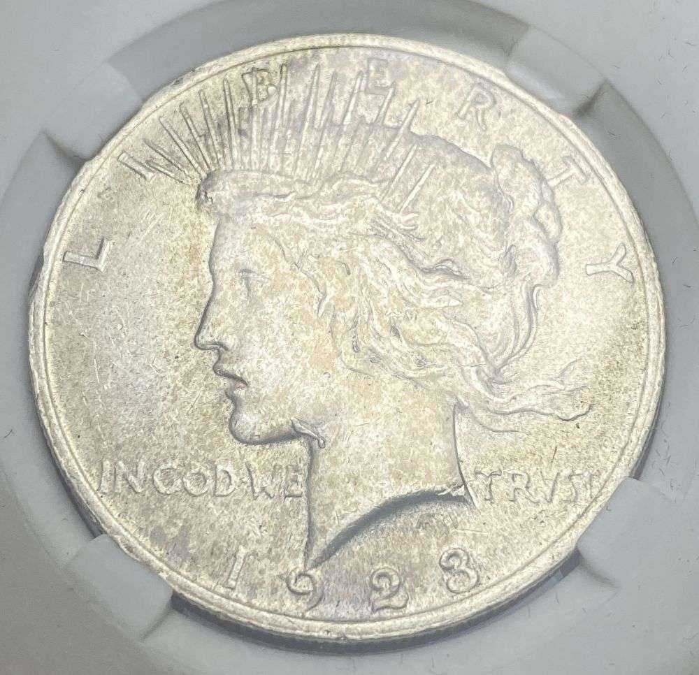 1923 Peace Silver Dollar AU55 Whisker Jaw: IMPORTANT NOTE: We do not agree with the grade provided with this "off-brand" grading company. Winner shall receive the exact coin shown here. (RR)
