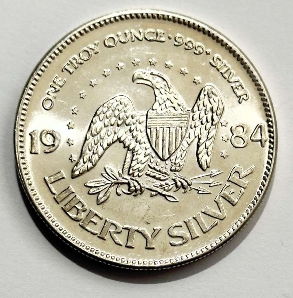 1984 A-Mark "Life Liberty Happiness" 1 ozt .999 Silver: Winner shall receive the exact coin shown here. (SJ/B)