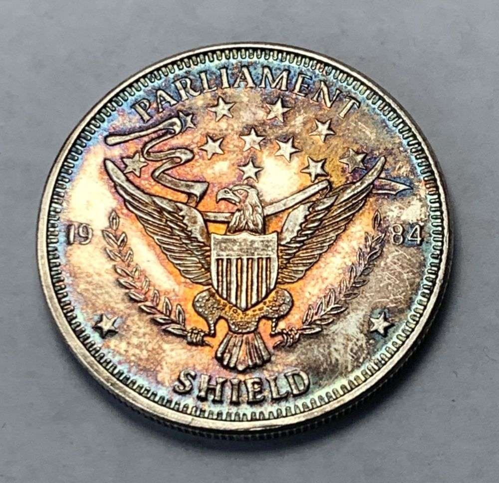 Toned 1984 Parliament Shield 1 ozt .999 Silver: Winner shall receive the exact coin shown here. (MK/B)
