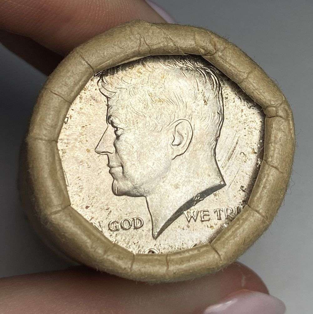 Original Bank Wrapped Roll (20) 1964 JFK Silver Half Dollar: This is a either a 1964-P or 1964-D but because it came out of the Seattle Washington area, we're gonna assume it's a "D." We looked on the PCGS priceguide and if a person was lucky enough to get PCGS