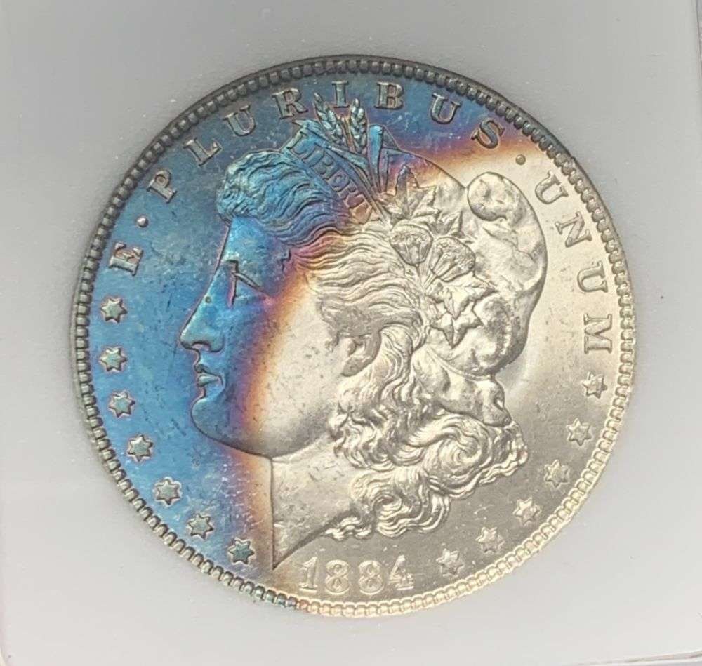 Toned 1884-O Morgan Silver Dollar MS66: IMPORTANT NOTE: We do not agree with the grade provided with this "off-brand" grading company. Winner shall receive the exact coin shown here. (MK/B)
