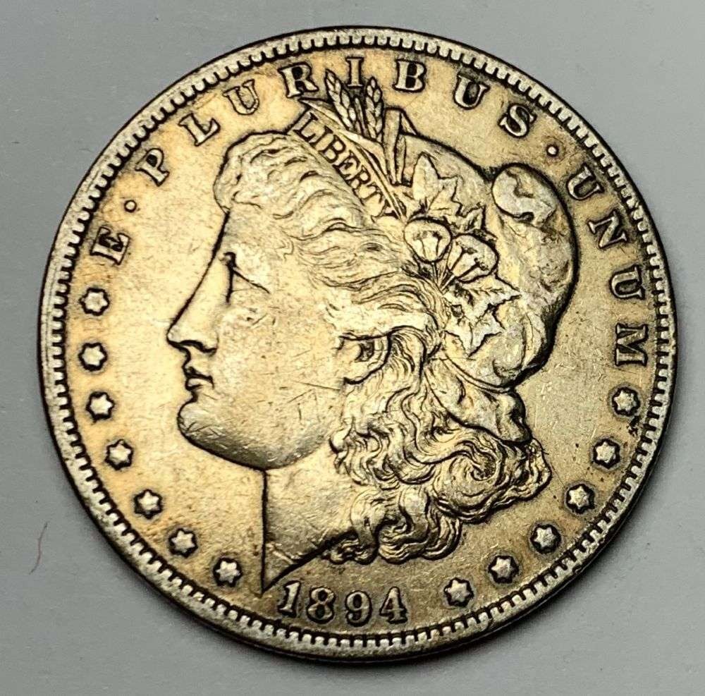 1894-O Morgan Silver Dollar VF: Winner shall receive the exact coin shown here. (MR/B)