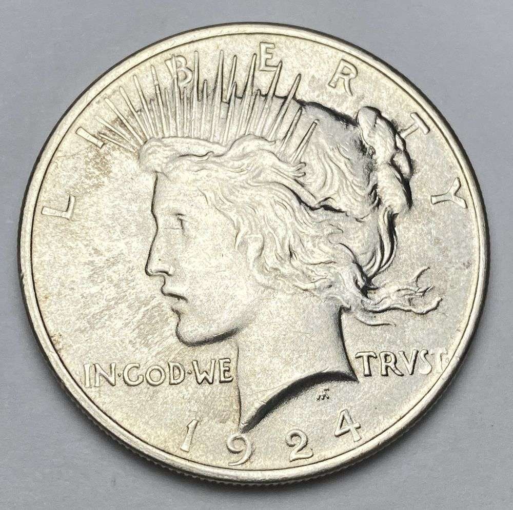 1924 Peace Silver Dollar MS65: Winner shall receive the exact coin shown here. (RR/PB)