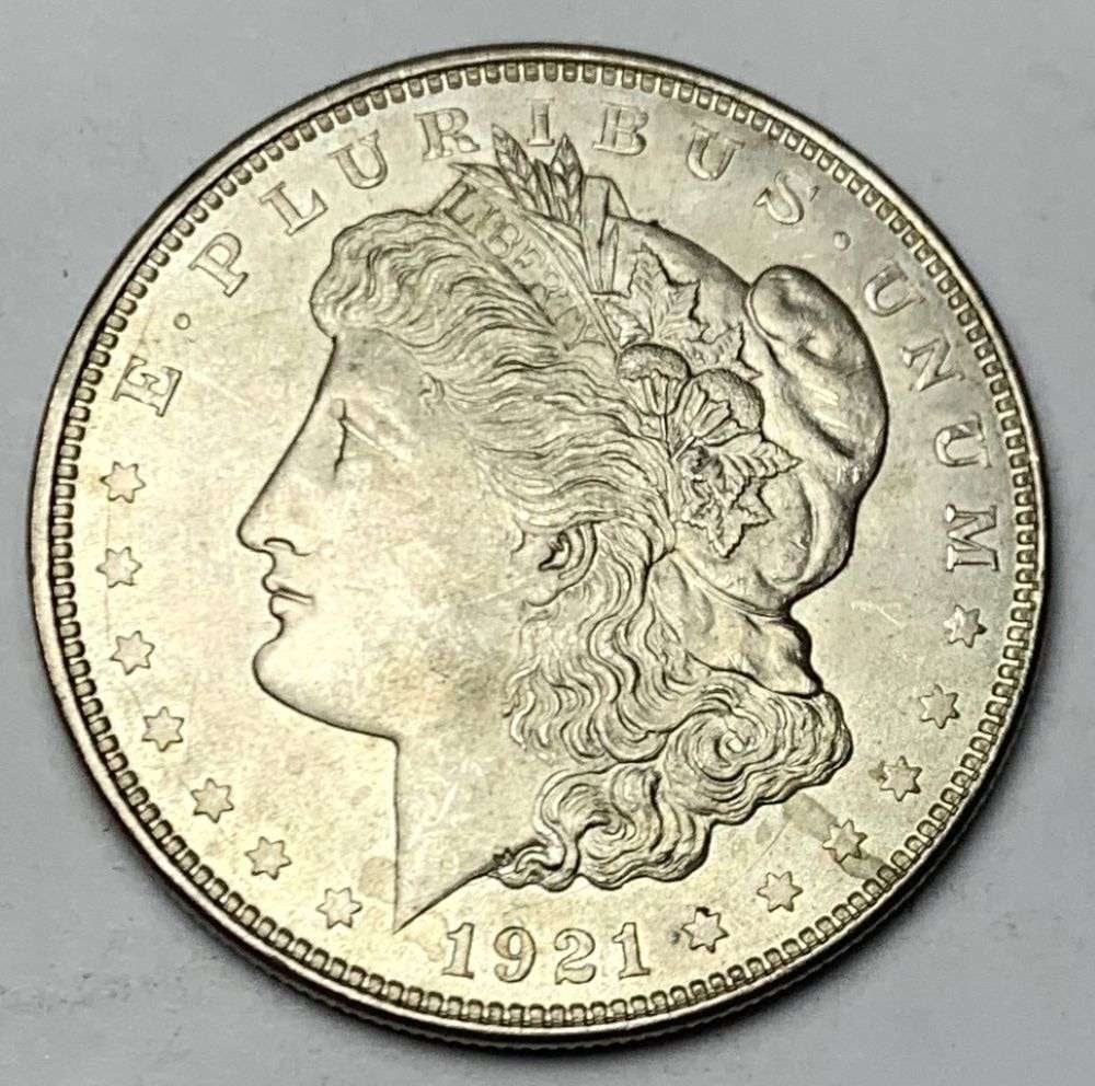 1921 Morgan Silver Dollar MS65: A very special consignment. Once in a great while, some really, really nice silver dollars will hit the market. These coins come from a old, old-timer! By order of the consignor, none of these coins a