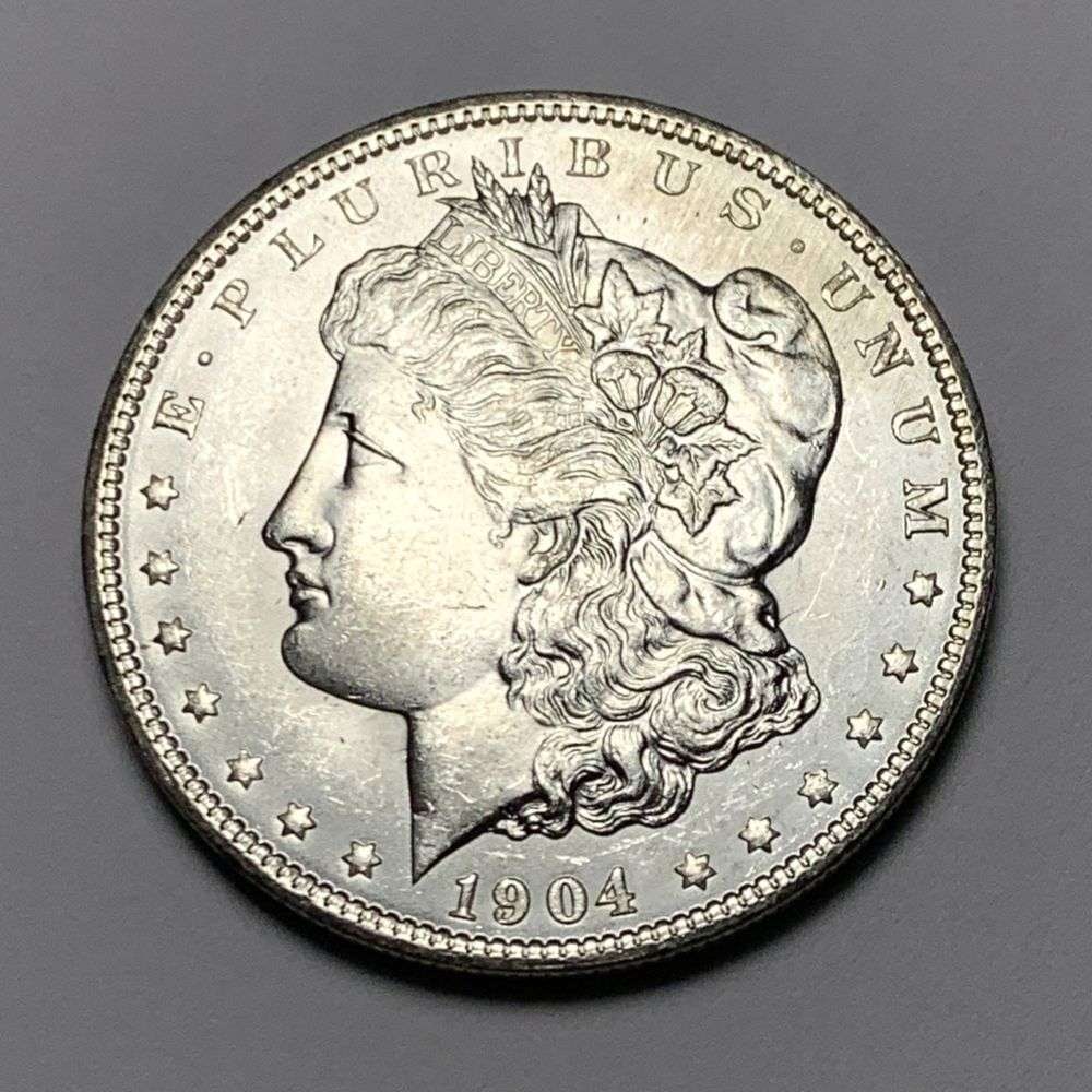 1904-O Morgan Silver Dollar MS64: A very special consignment. Once in a great while, some really, really nice silver dollars will hit the market. These coins come from a old, old-timer! By order of the consignor, none of these coins a
