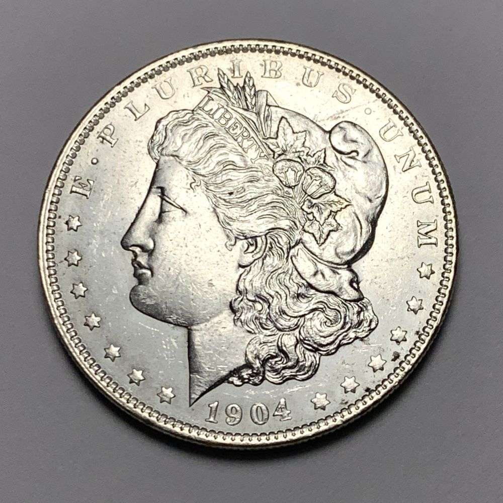 1904-O Morgan Silver Dollar MS64: A very special consignment. Once in a great while, some really, really nice silver dollars will hit the market. These coins come from a old, old-timer! By order of the consignor, none of these coins a