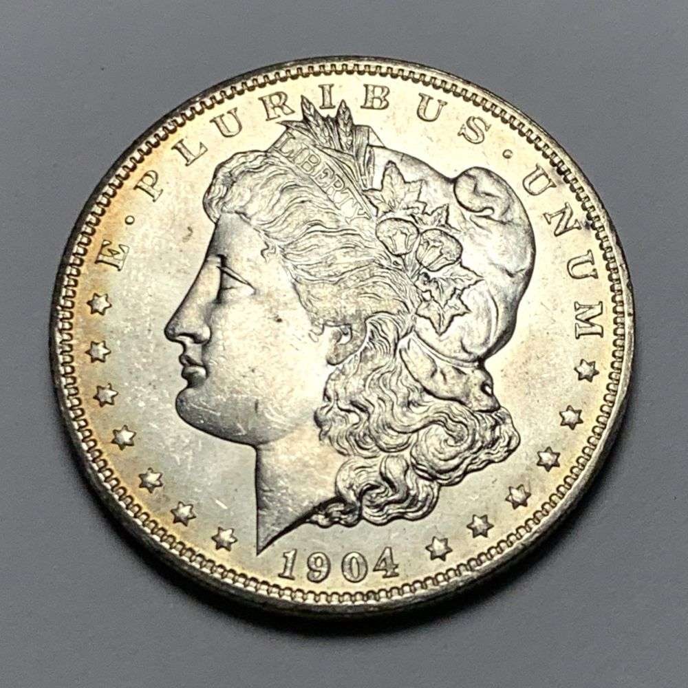 1904-O Morgan Silver Dollar MS64: A very special consignment. Once in a great while, some really, really nice silver dollars will hit the market. These coins come from a old, old-timer! By order of the consignor, none of these coins a