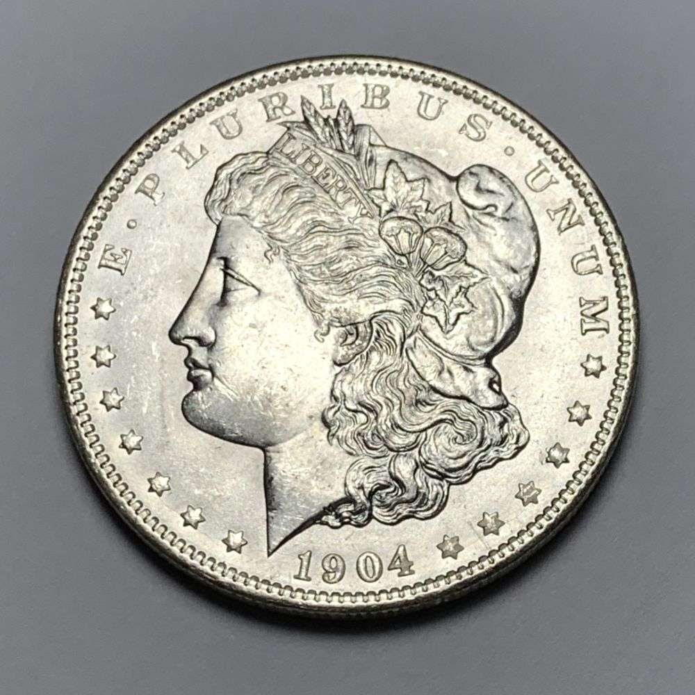 1904-O Morgan Silver Dollar MS64: A very special consignment. Once in a great while, some really, really nice silver dollars will hit the market. These coins come from a old, old-timer! By order of the consignor, none of these coins a