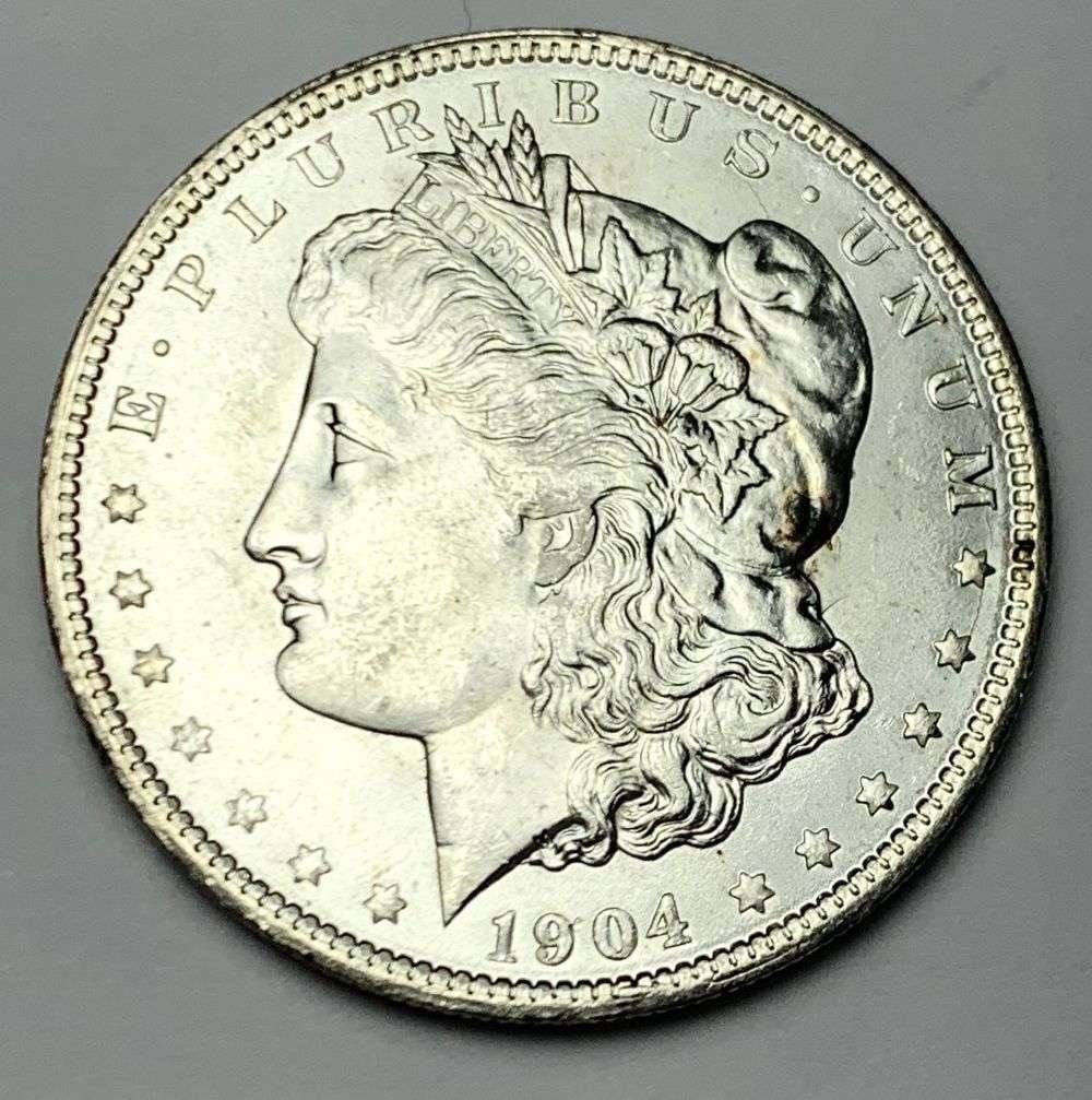 1904-O Morgan Silver Dollar MS65: A very special consignment. Once in a great while, some really, really nice silver dollars will hit the market. These coins come from a old, old-timer! By order of the consignor, none of these coins a