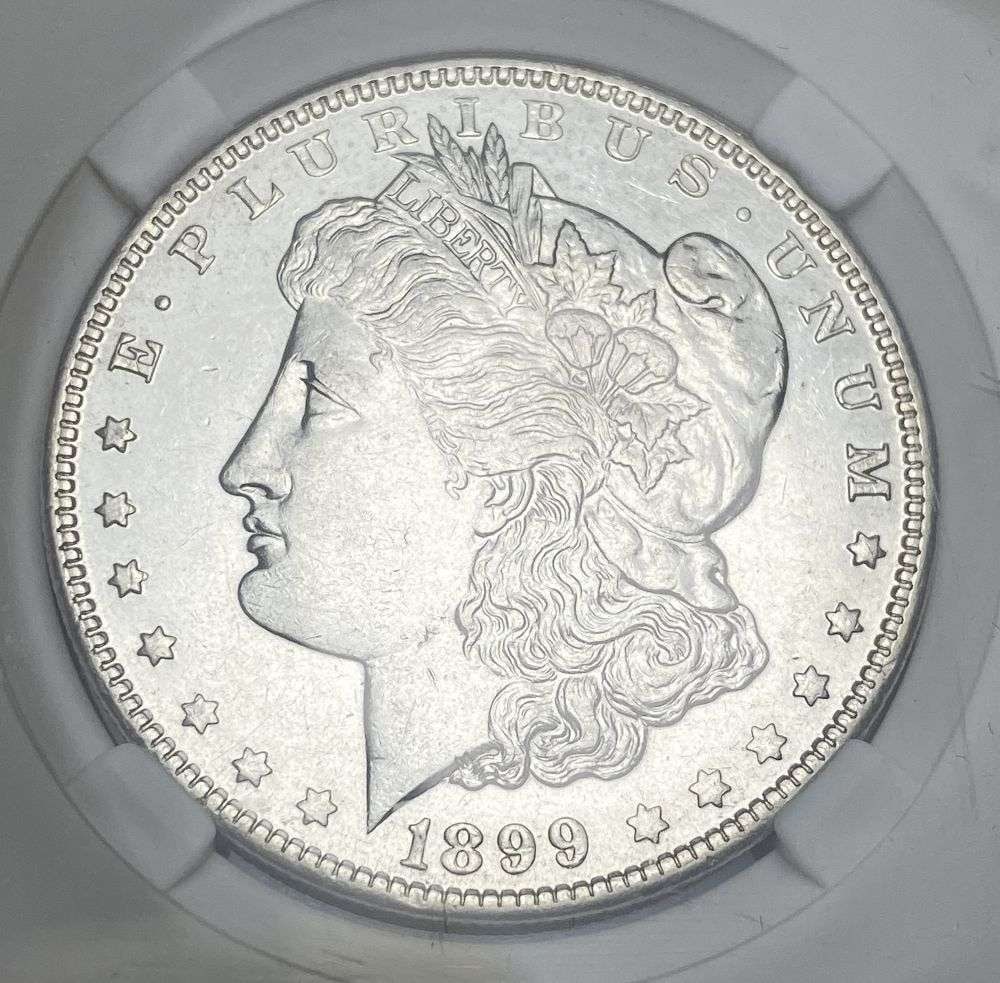 1899-O Micro "O" Morgan Silver Dollar MS62: IMPORTANT NOTE: We do not agree with the grade provided with this "off-brand" grading company. Winner shall receive the exact coin shown here. (RR)