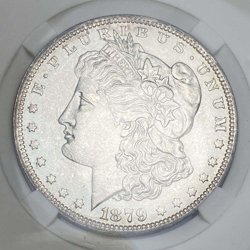 1879-O Morgan Silver Dollar MS65: IMPORTANT NOTE: We do not agree with the grade provided with this "off-brand" grading company. Winner shall receive the exact coin shown here. (RR)