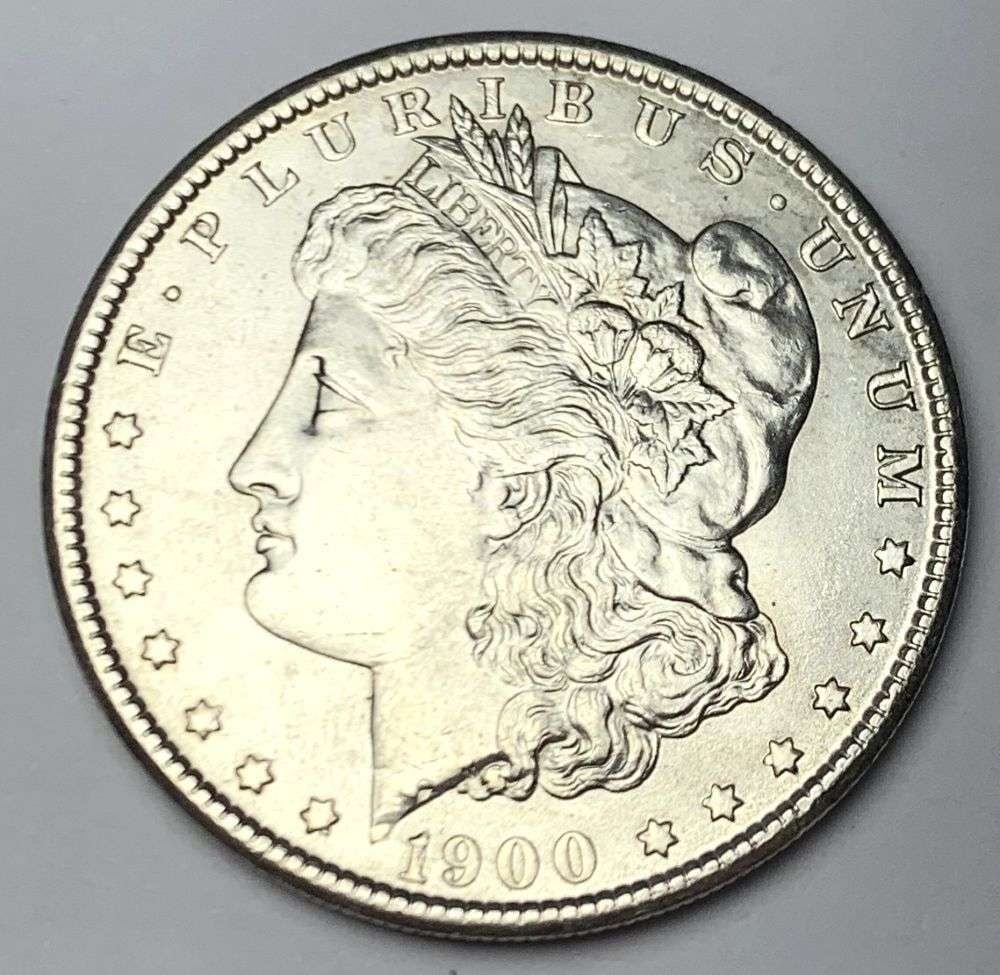 1900 Morgan Silver Dollar MS64: A very special consignment. Once in a great while, some really, really nice silver dollars will hit the market. These coins come from a old, old-timer! By order of the consignor, none of these coins