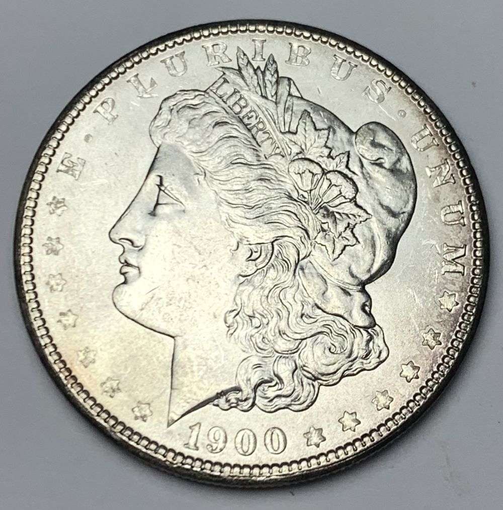 1900 Morgan Silver Dollar MS64: A very special consignment. Once in a great while, some really, really nice silver dollars will hit the market. These coins come from a old, old-timer! By order of the consignor, none of these coins a