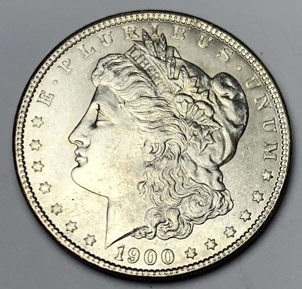 1900 Morgan Silver Dollar MS64: A very special consignment. Once in a great while, some really, really nice silver dollars will hit the market. These coins come from a old, old-timer! By order of the consignor, none of these coins a
