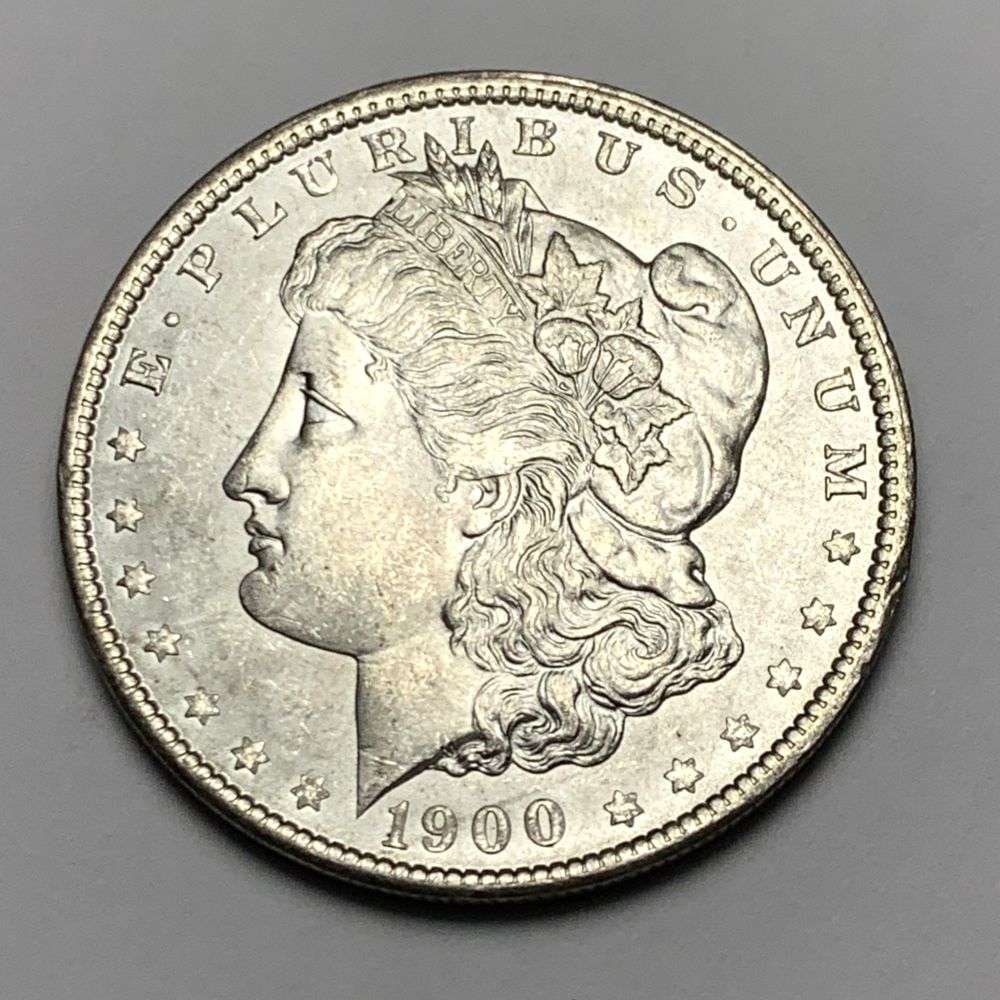 1900 Morgan Silver Dollar MS65: A very special consignment. Once in a great while, some really, really nice silver dollars will hit the market. These coins come from a old, old-timer! By order of the consignor, none of these coins a