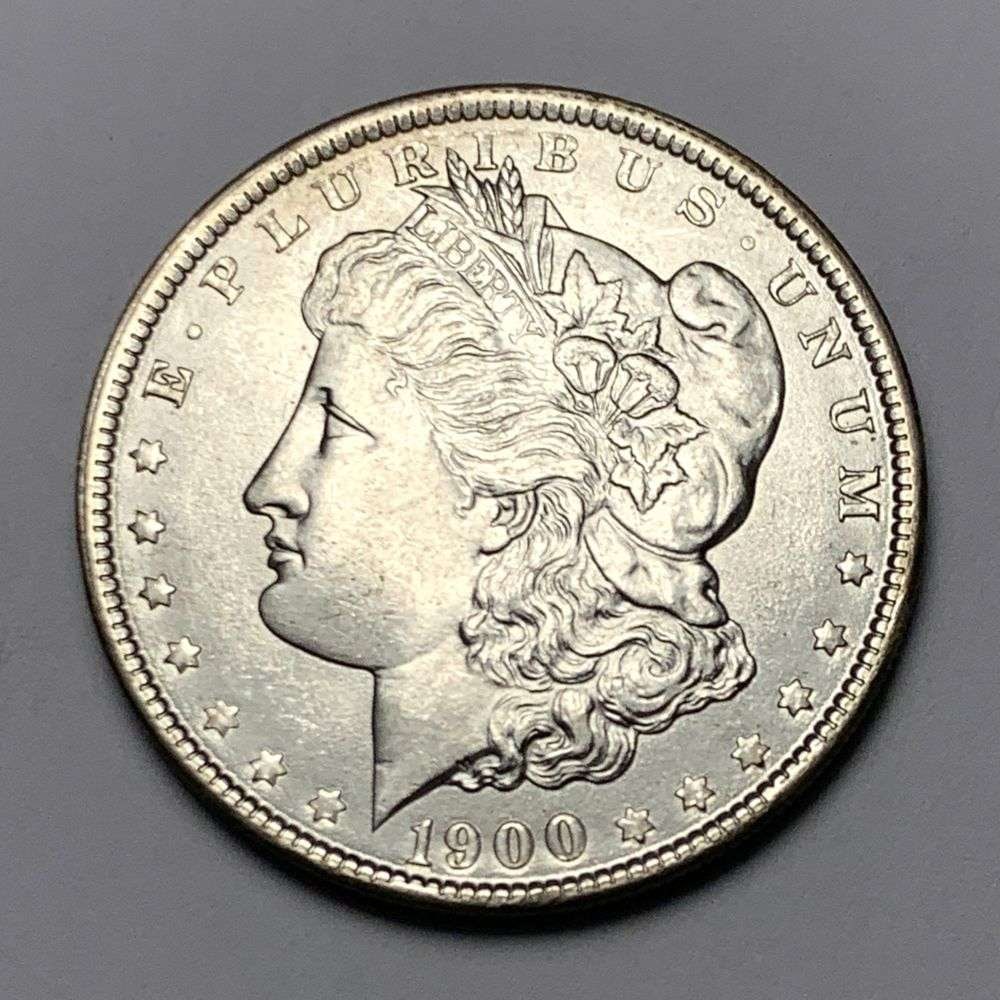 1900 Morgan Silver Dollar MS65: A very special consignment. Once in a great while, some really, really nice silver dollars will hit the market. These coins come from a old, old-timer! By order of the consignor, none of these coins a