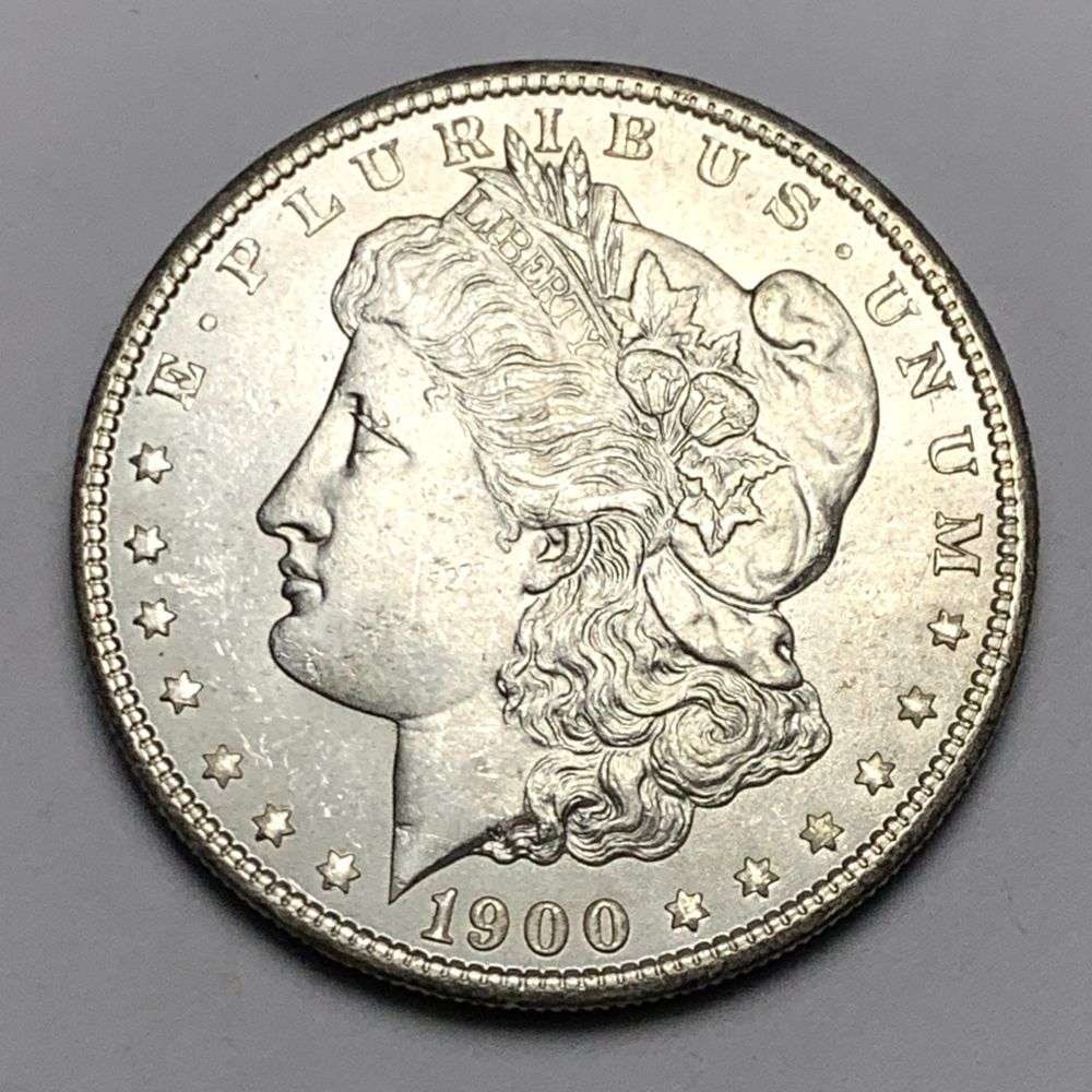 1900 Morgan Silver Dollar MS65: A very special consignment. Once in a great while, some really, really nice silver dollars will hit the market. These coins come from a old, old-timer! By order of the consignor, none of these coins a