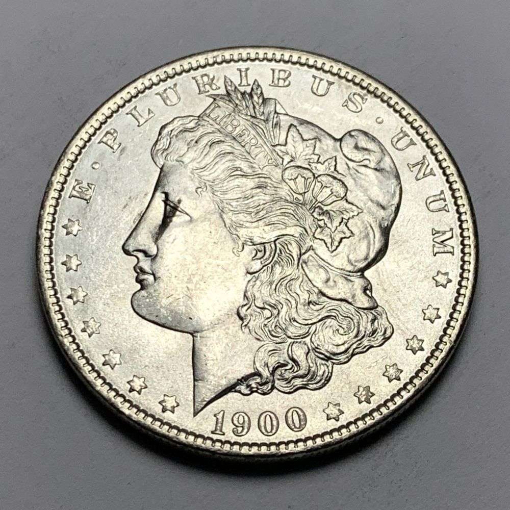 1900 Morgan Silver Dollar MS65: A very special consignment. Once in a great while, some really, really nice silver dollars will hit the market. These coins come from a old, old-timer! By order of the consignor, none of these coins a