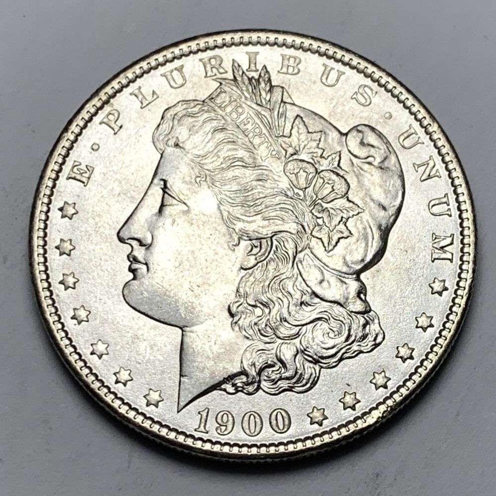 1900 Morgan Silver Dollar MS65: A very special consignment. Once in a great while, some really, really nice silver dollars will hit the market. These coins come from a old, old-timer! By order of the consignor, none of these coins a