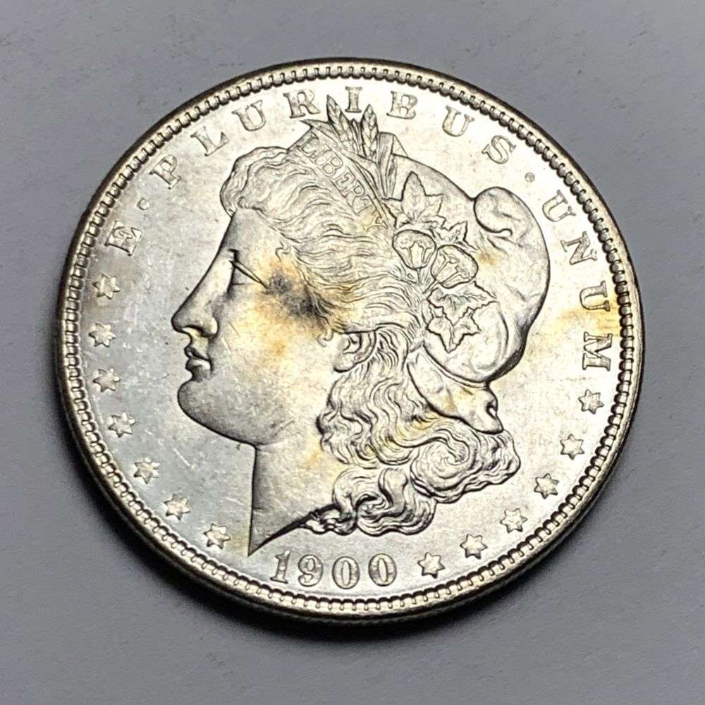 1900 Morgan Silver Dollar MS65: A very special consignment. Once in a great while, some really, really nice silver dollars will hit the market. These coins come from a old, old-timer! By order of the consignor, none of these coins a