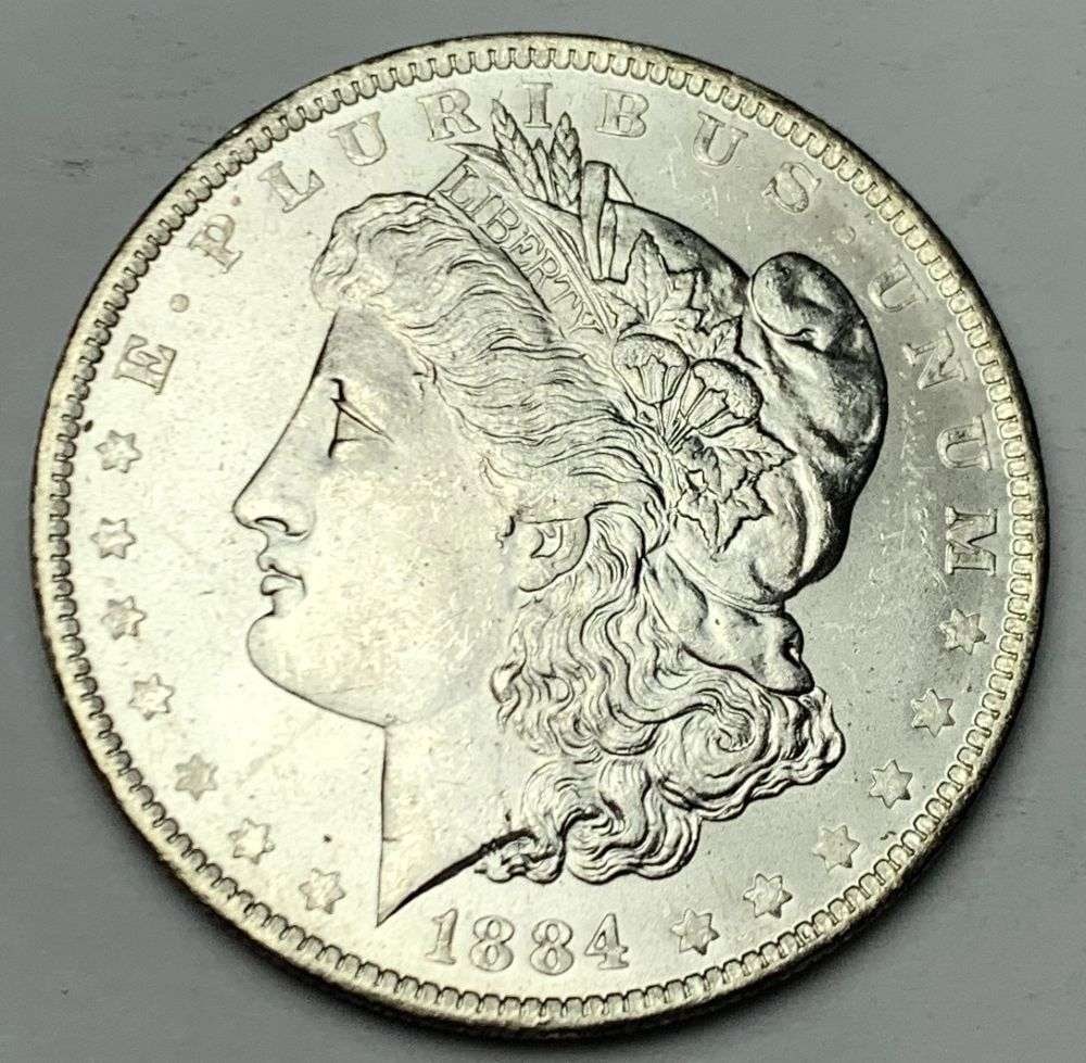 1884-O Morgan Silver Dollar MS64: A very special consignment. Once in a great while, some really, really nice silver dollars will hit the market. These coins come from a old, old-timer! By order of the consignor, none of these coins a