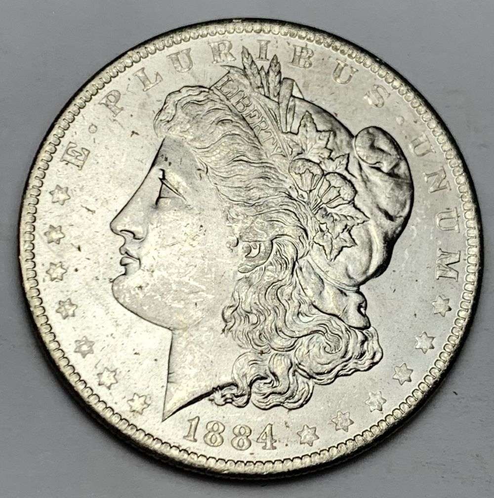 1884-O Morgan Silver Dollar MS64: A very special consignment. Once in a great while, some really, really nice silver dollars will hit the market. These coins come from a old, old-timer! By order of the consignor, none of these coins a