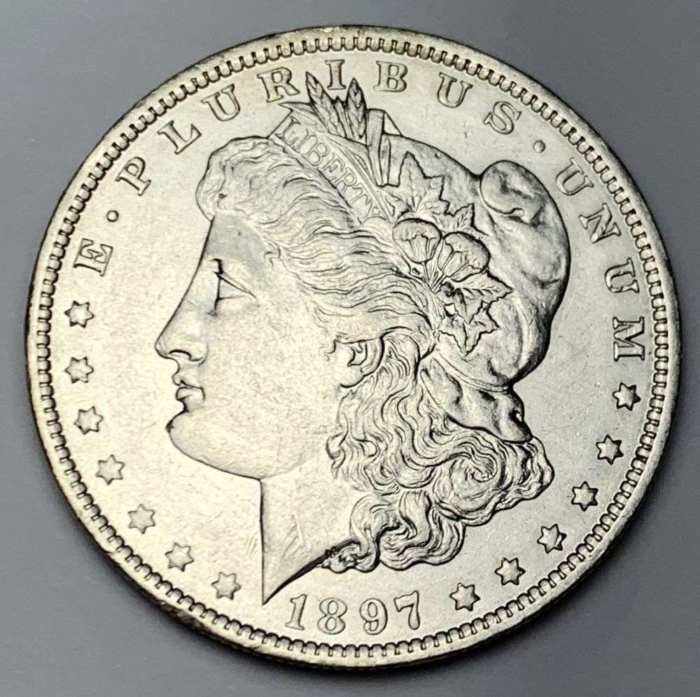 1897-O Morgan Silver Dollar AU58: Winner shall receive the exact coin shown here. (MR/B)