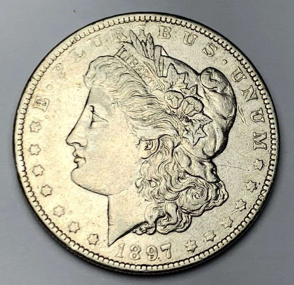 1897-O morgan Silver Dollar AU55: Winner shall receive the exact coin shown here. (MR/B)