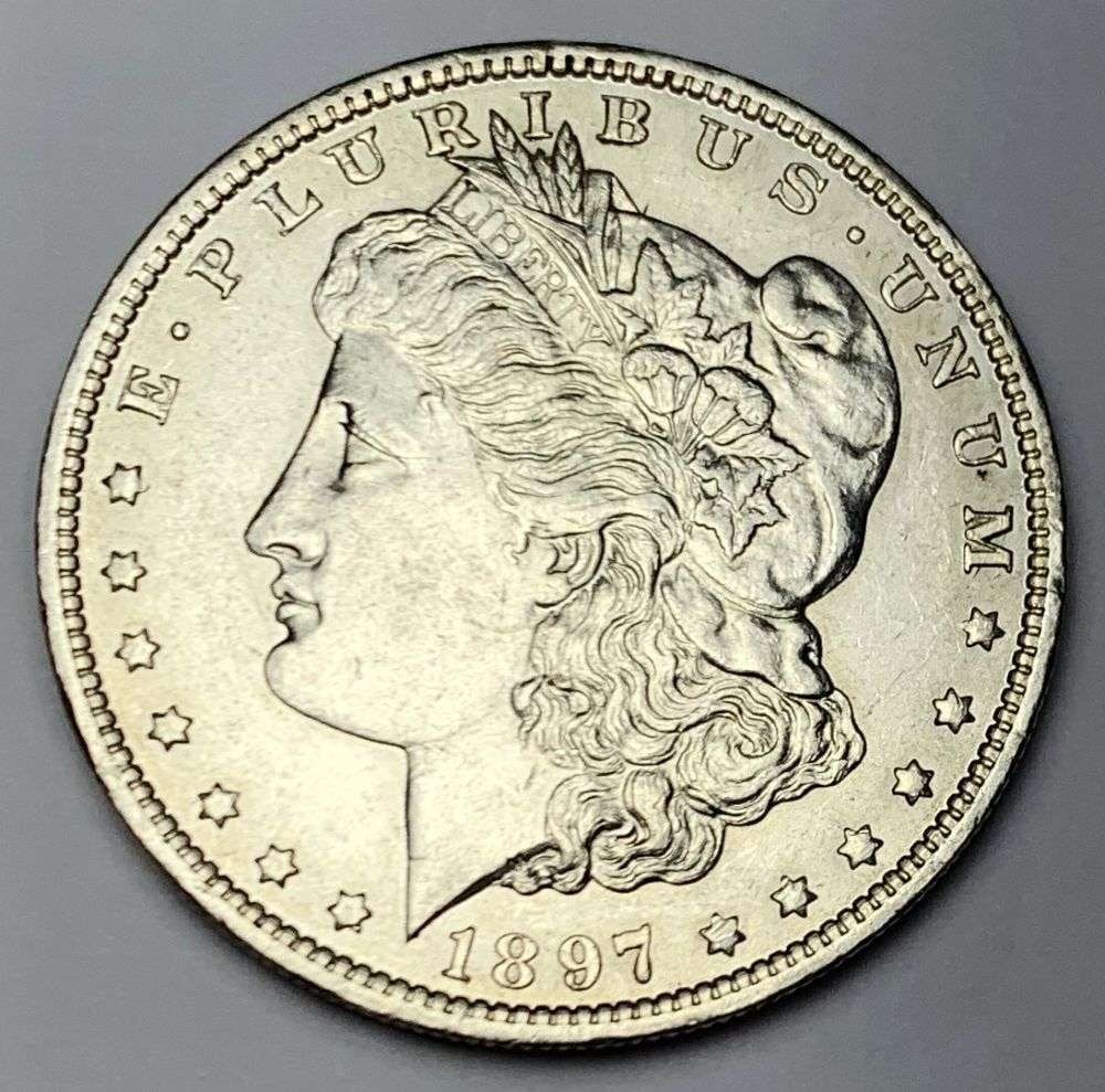 1897-O Morgan Silver Dollar AU55: Winner shall receive the exact coin shown here. (MR/B)