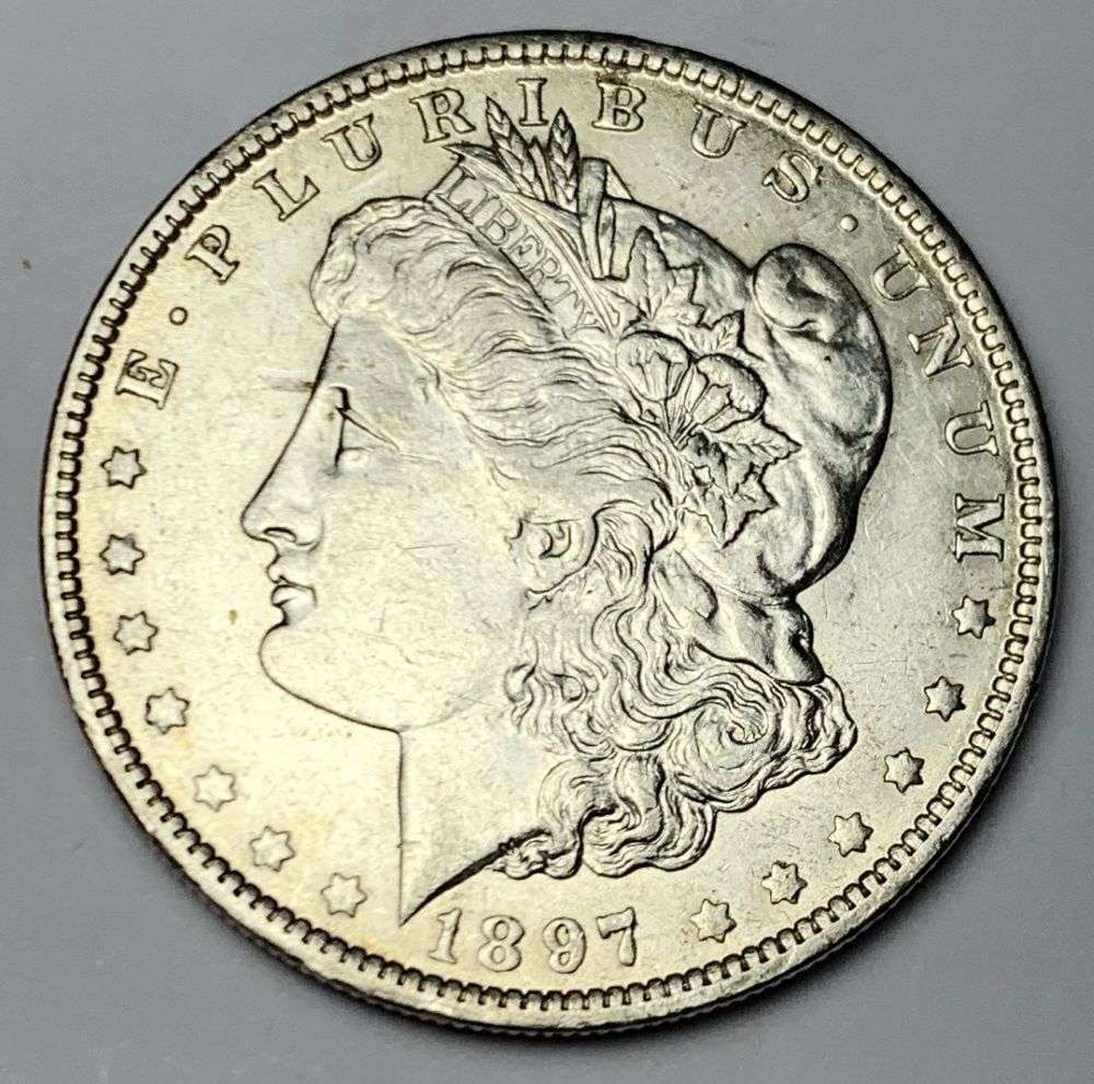 1897-O Morgan Silver Dollar AU55: Winner shall receive the exact coin shown here. (MR/B)