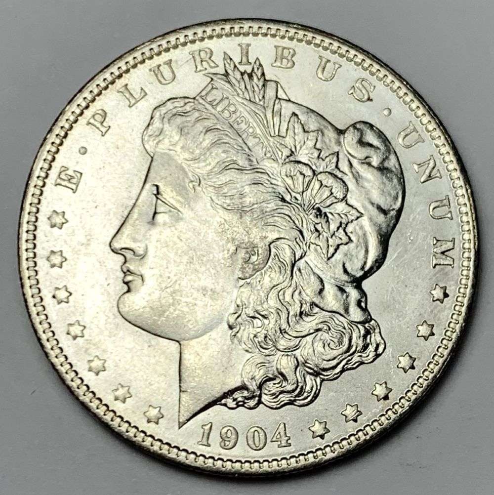 1904-O Morgan Silver Dollar MS65: A very special consignment. Once in a great while, some really, really nice silver dollars will hit the market. These coins come from a old, old-timer! By order of the consignor, none of these coins a