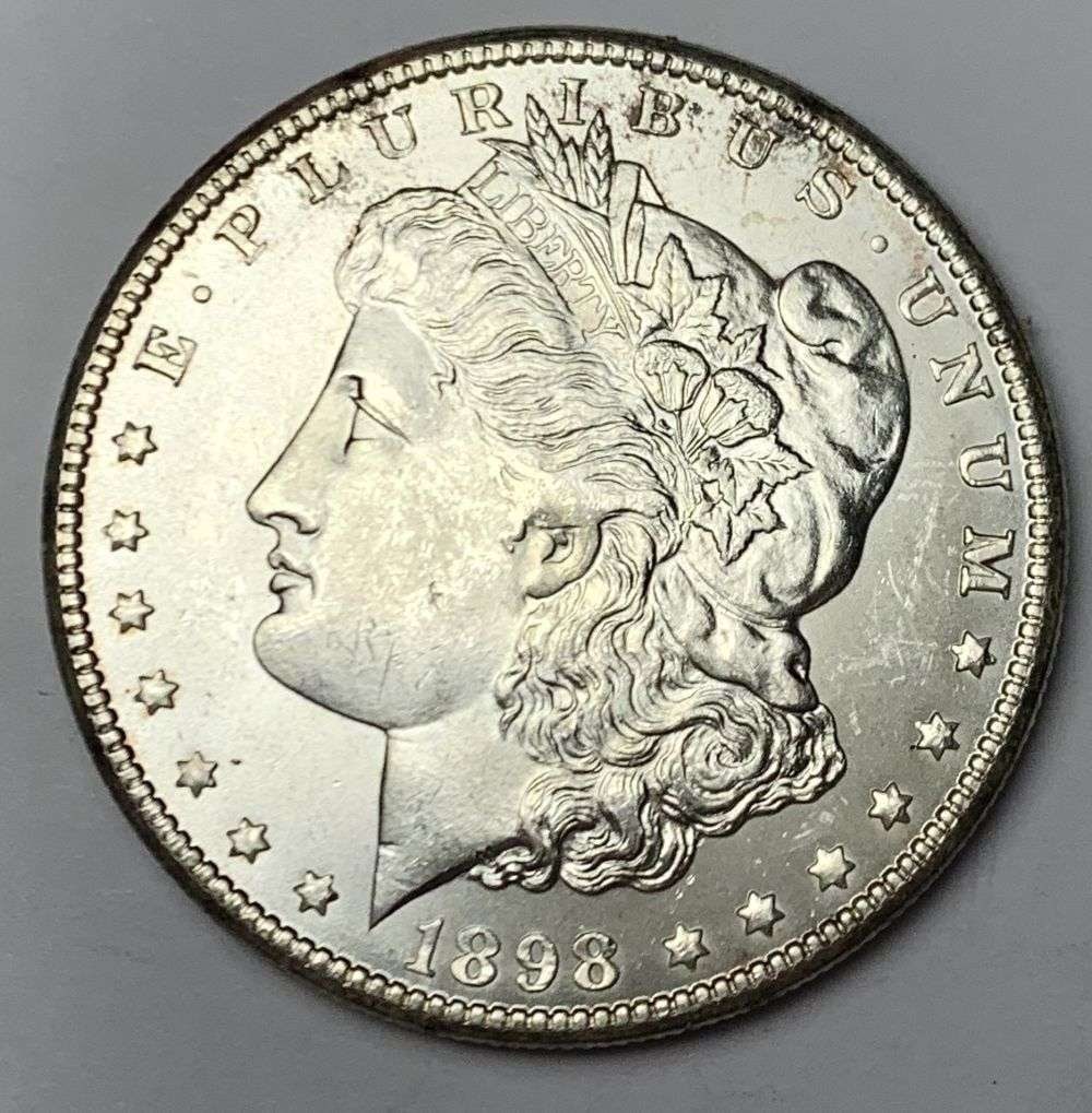 1898-O Morgan Silver Dollar MS65: A very special consignment. Once in a great while, some really, really nice silver dollars will hit the market. These coins come from a old, old-timer! By order of the consignor, none of these coins a