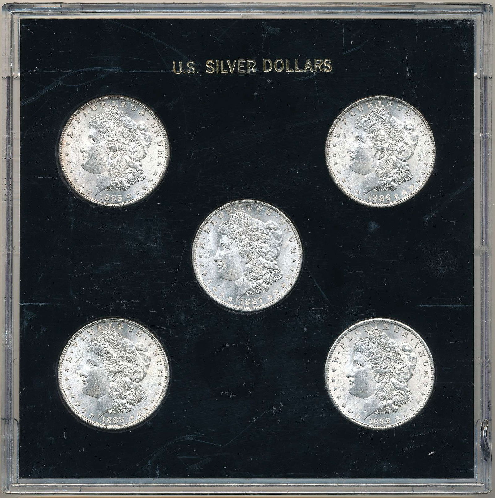 1885-1889 Morgan Silver Dollar Set Museum Quality Choice BU (5-coins): Our consignor is a weekend coin dealer who owns a few businesses around the state of Washington. The owner of the Miracle of America Museum sold their entire numismatic holding to Phil recently when t