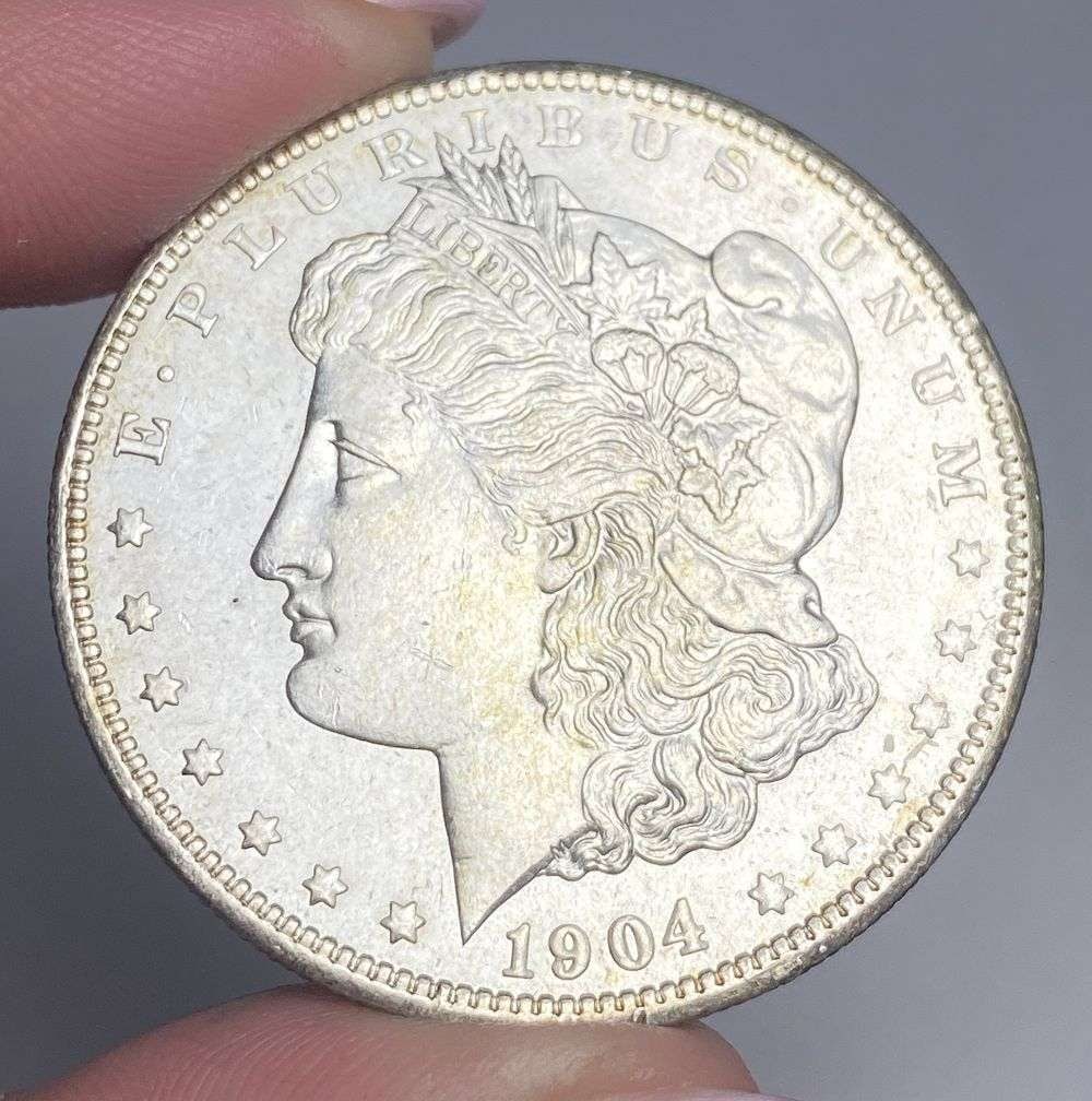 1904-O Morgan Silver Dollar MS65: A very special consignment. Once in a great while, some really, really nice silver dollars will hit the market. These coins come from a old, old-timer! By order of the consignor, none of these coins a