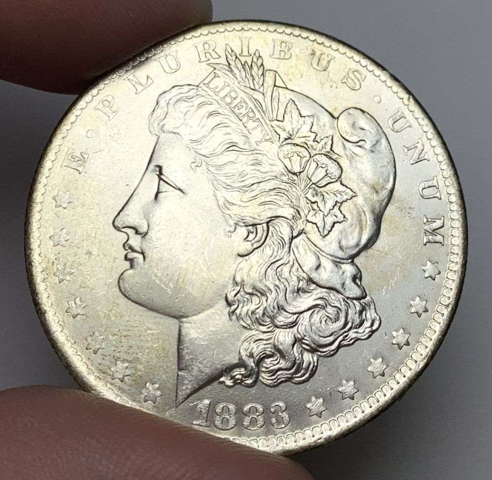 1883-O Morgan Silver Dollar MS64: A very special consignment. Once in a great while, some really, really nice silver dollars will hit the market. These coins come from a old, old-timer! By order of the consignor, none of these coins a