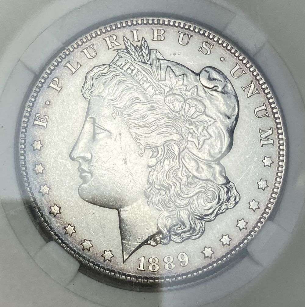 1889-S Morgan Silver Dollar MS62+: IMPORTANT NOTE: We do not agree with the grade provided with this "off-brand" grading company. Winner shall receive the exact coin shown here. (RR/RB)