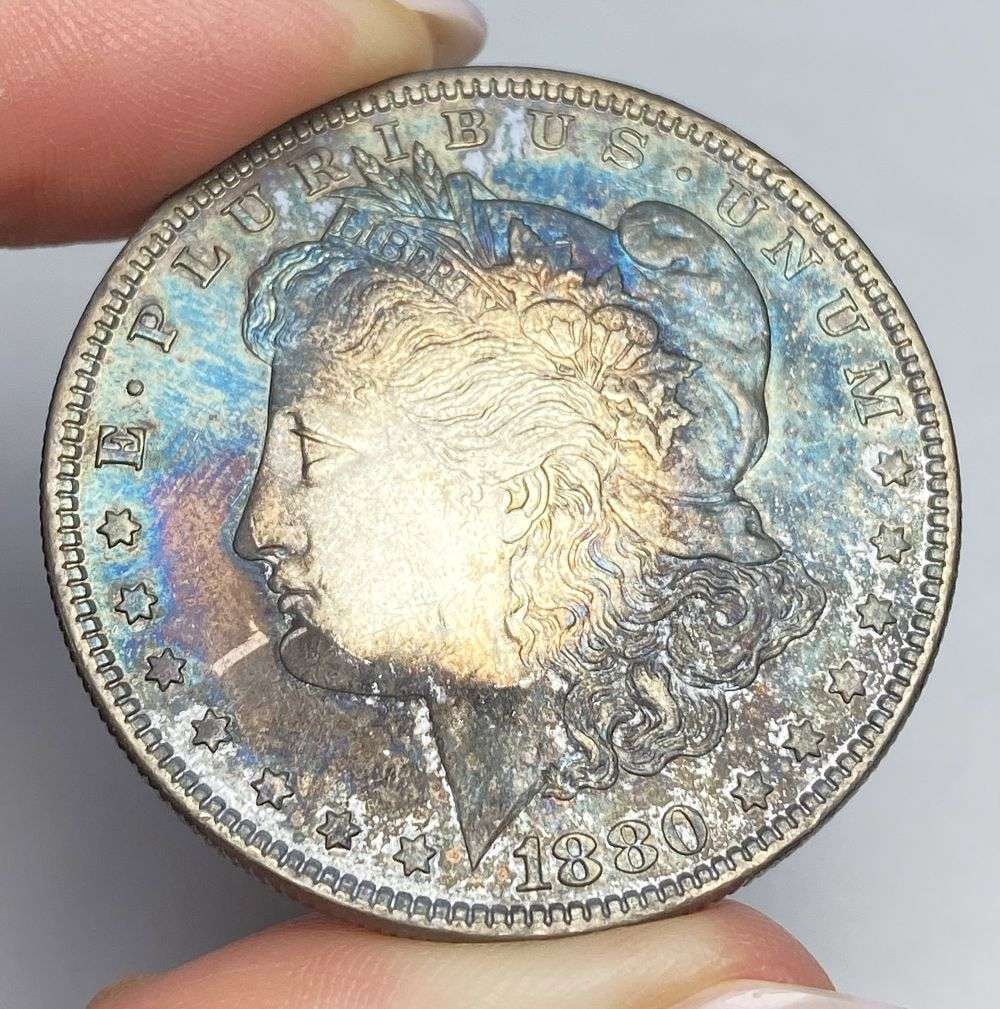 Toned 1880-O Morgan Silver Dollar: Winner shall receive the exact coin shown here. (RR)
