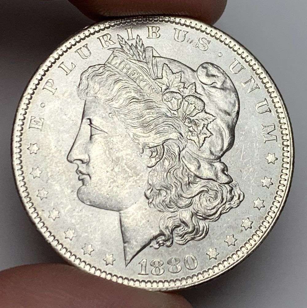 1880 Morgan Silver Dollar MS64: A very special consignment. Once in a great while, some really, really nice silver dollars will hit the market. These coins come from a old, old-timer! By order of the consignor, none of these coins a
