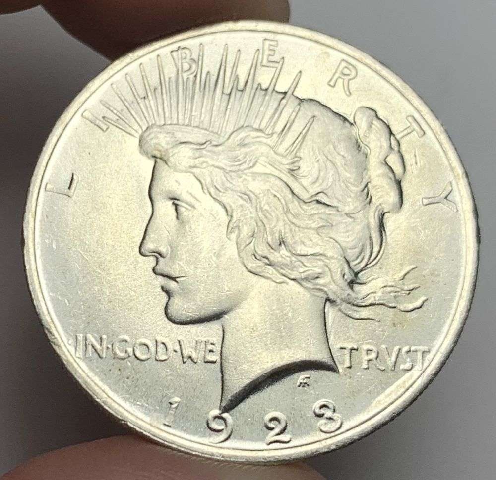 1923 Peace Silver Dollar MS63: A very special consignment. Once in a great while, some really, really nice silver dollars will hit the market. These coins come from a old, old-timer! By order of the consignor, none of these coins a