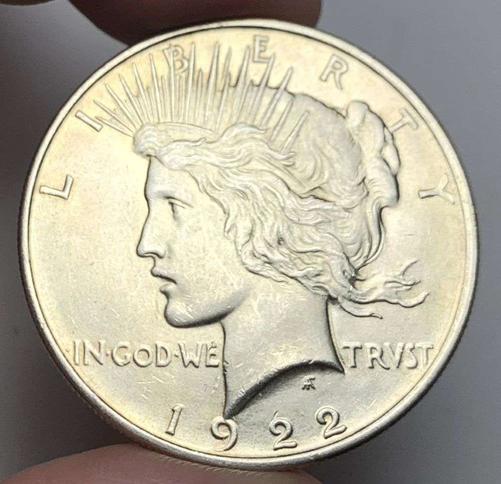 1922 Peace Silver Dollar MS63: A very special consignment. Once in a great while, some really, really nice silver dollars will hit the market. These coins come from a old, old-timer! By order of the consignor, none of these coins a