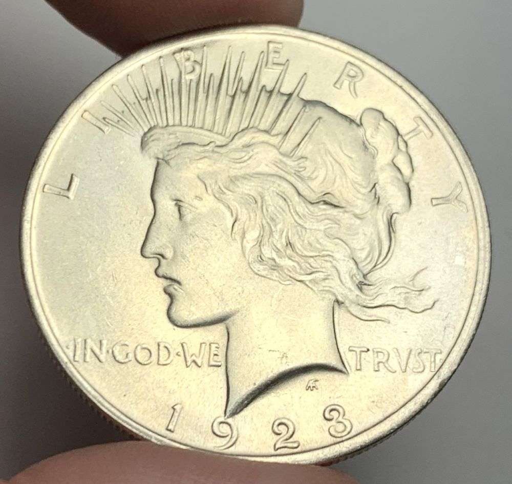 1923 Peace Silver Dollar MS63: A very special consignment. Once in a great while, some really, really nice silver dollars will hit the market. These coins come from a old, old-timer! By order of the consignor, none of these coins
