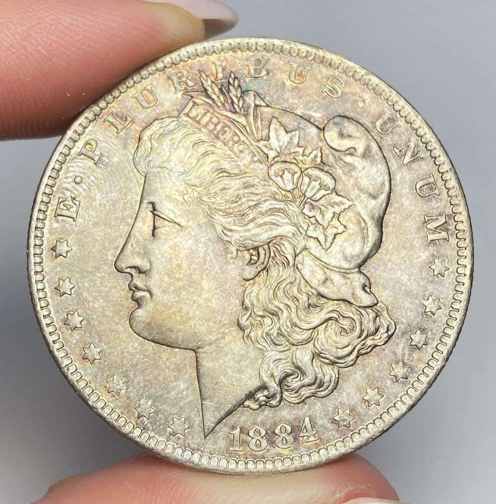 Toned 1884-O Morgan Silver Dollar MS64: A very special consignment. Once in a great while, some really, really nice silver dollars will hit the market. These coins come from a old, old-timer! By order of the consignor, none of these coins a