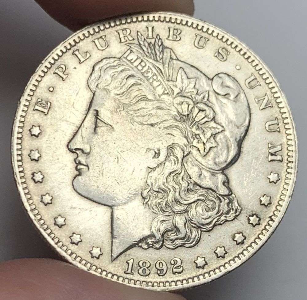 Rare Date 1892-O Morgan Silver Dollar XF: Winner shall recieve the exact coin shown here. (MR/B)