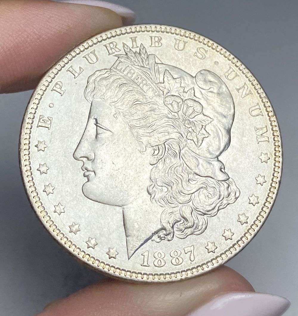 1887 Morgan Silver Dollar MS66: Winner shall receive the exact coin shown here. (RR/B)