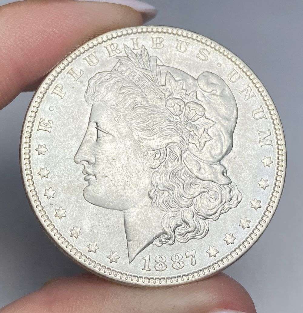 1887 Morgan Silver Dollar MS66: Winner shall receive the exact coin shown here. (RR/B)