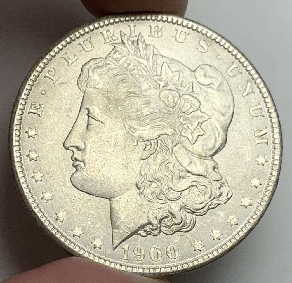 1900 Morgan Silver Dollar MS63: A very special consignment. Once in a great while, some really, really nice silver dollars will hit the market. These coins come from a old, old-timer! By order of the consignor, none of these coins a