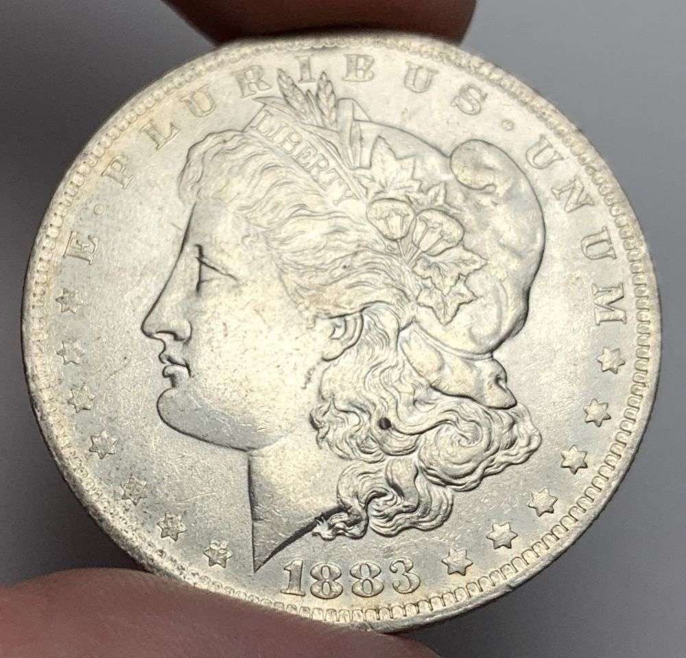 1883-O Morgan Silver Dollar MS63: A very special consignment. Once in a great while, some really, really nice silver dollars will hit the market. These coins come from a old, old-timer! By order of the consignor, none of these coins a