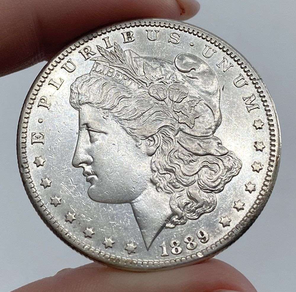 1889-CC Morgan Silver Dollar AU58 Details: Winner shall receive the exact coin shown here. (RR)