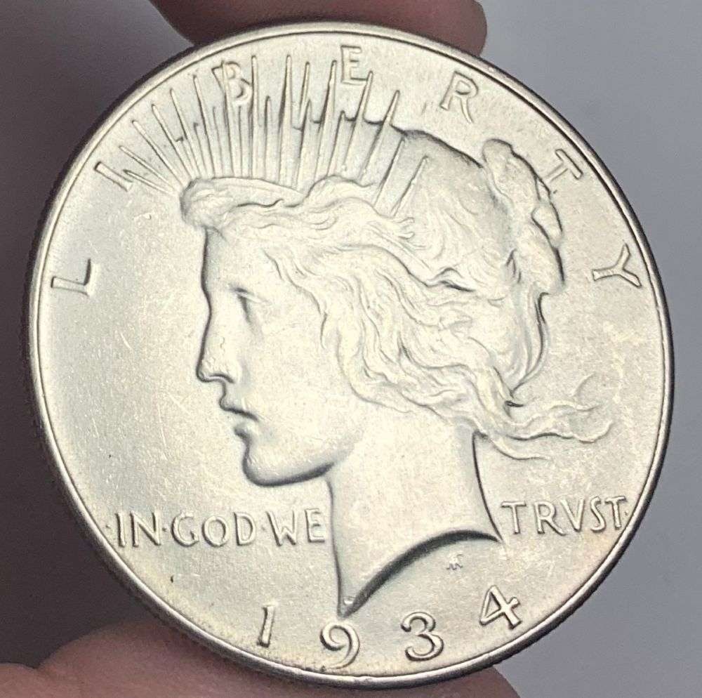 1934 Peace Silver Dollar MS65: A very special consignment. Once in a great while, some really, really nice silver dollars will hit the market. These coins come from a old, old-timer! By order of the consignor, none of these coins a